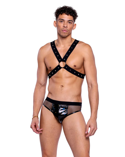 Man wearing a black strappy top and mesh underwear on a white background