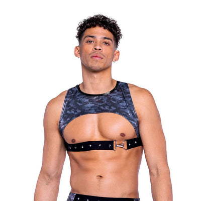Man wearing a patterned sports bra and shorts set on a white background