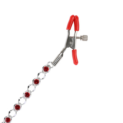 A silver metal spring clamp with red handles and a decorative chain of red gemstone accents, isolated on a white background.