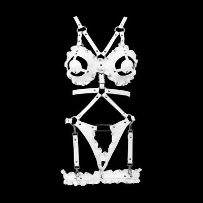 White strappy harness lingerie set with skull-print cups and matching garter-style bottom, displayed on a black background.