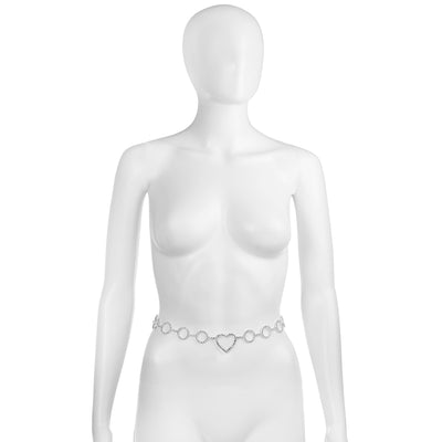A white mannequin torso wearing a thin silver chain belt with a central heart-shaped link and circular links, shown against a plain white background.