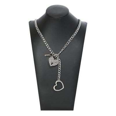 Silver chain necklace with heart pendants on a black mannequin bust.