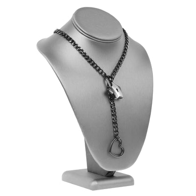 Black chain necklace with a lock and heart pendant on a gray jewelry stand.