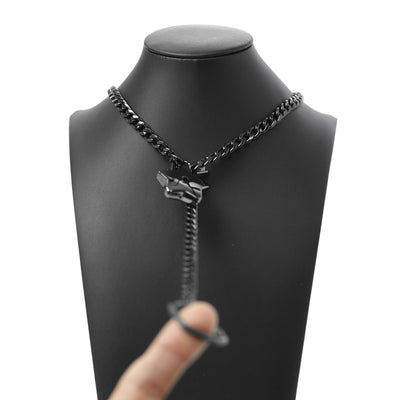 Black chain necklace with a unique clasp on a mannequin bust.