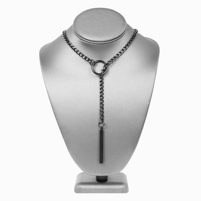 Black chain necklace on a silver mannequin bust against a white background