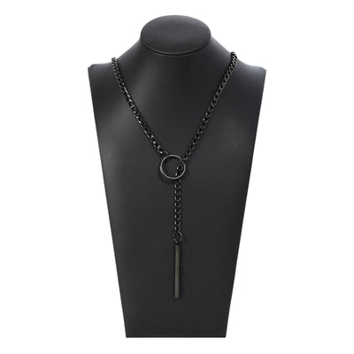 Black chain necklace on a black mannequin bust against a white background