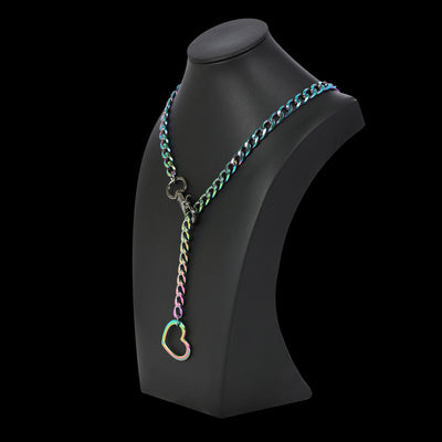 Necklace with a heart-shaped clasp on a black mannequin bust against a white background