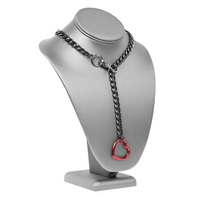 Necklace with a red heart pendant on a gray bust
