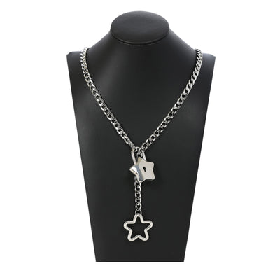 Silver chain necklace with star pendants on a black mannequin bust.