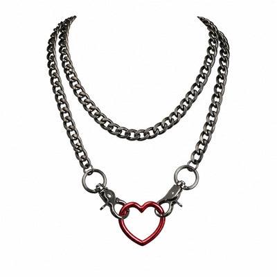 A double-layered necklace featuring a thick, dark gunmetal gray chain and a smaller silver chain. The silver chain is attached to a red heart-shaped ring and clasps onto the main chain.
