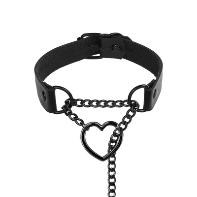 A black gothic-style collar featuring a central hanging chain with a heart-shaped ring and metal hardware, displayed on a clean white background.