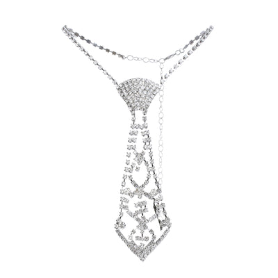A silver rhinestone tie necklace with a detailed cutout pendant, displayed on a clean white background.