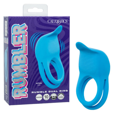A bright blue silicone dual ring adult novelty product shown next to its purple retail box. The packaging features the brand name 'CALEXOTICS' and the product name 'RUMBLER'.